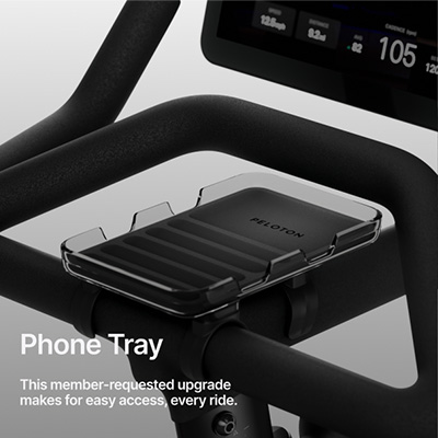 An infographic stating: "Phone Tray. This member-requested upgrade makes for easy access, every ride."