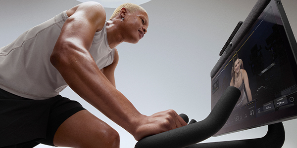 Image of a model following a cycling workout on the Peloton Cross Training Bike+