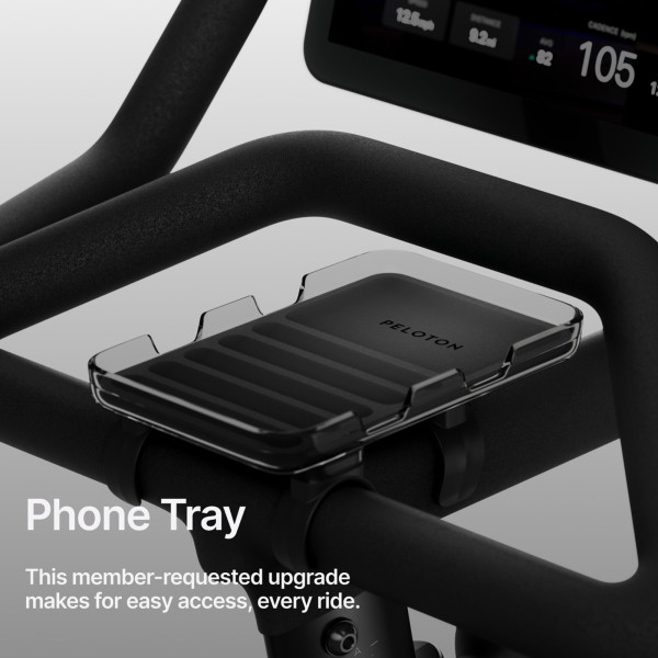 An infographic stating: "Phone Tray. This member-requested upgrade makes for easy access, every ride."