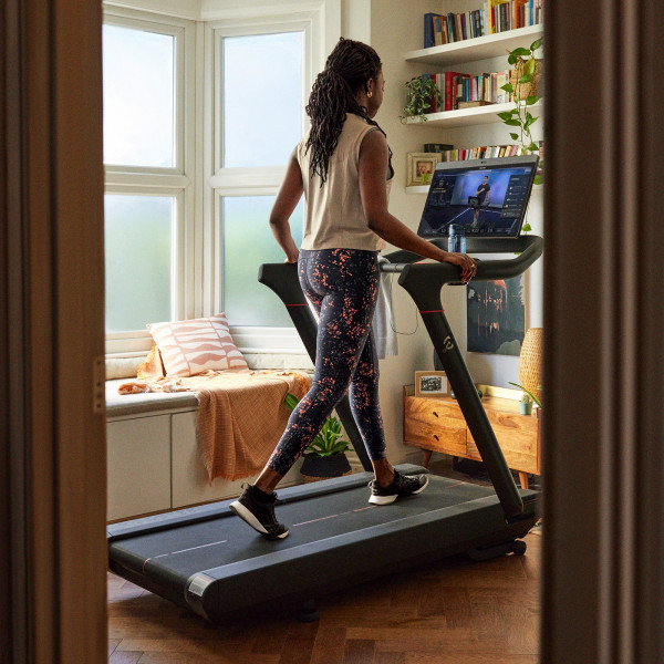 Person walking on the Peloton Original Series Tread during a guided class