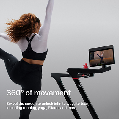 Infographic of a model performing a standing leg stretch with the swivel screen of the Peloton Cross Training Tread. A caption reads: 360-degrees of movement. Swivel the screen to unlock infinite ways to train, including running, yoga, Pilates and more.