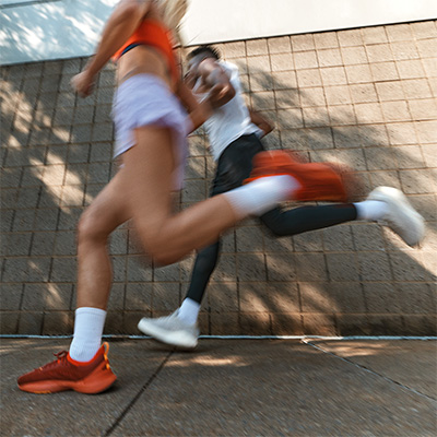 Models captured mid-stride on an outdoor run 