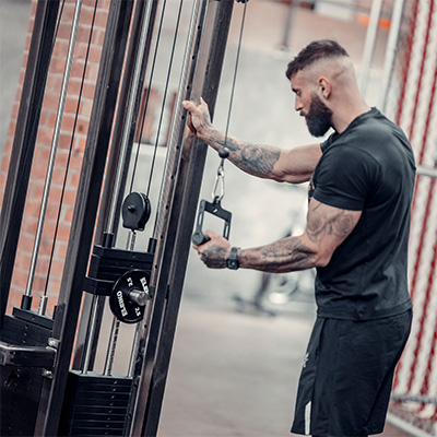 Model using the Power Pin on a weight stack 