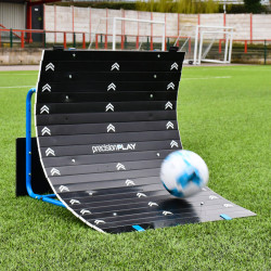 PrecisionPLAY Skills Trainer Ramp Rebounder on a football pitch with ball rebounding from the ramp