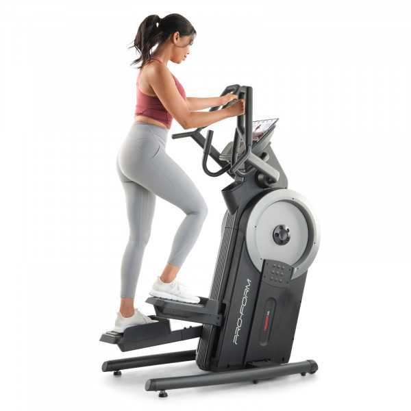 Person training on the ProForm Trainer HL Elliptical Machine & Stepper