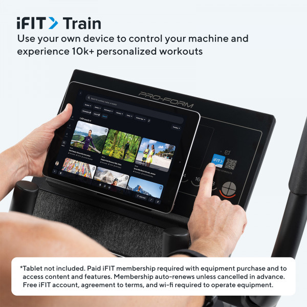 Model using the ProForm Carbon EL Elliptical with iFIT workouts on a tablet at home