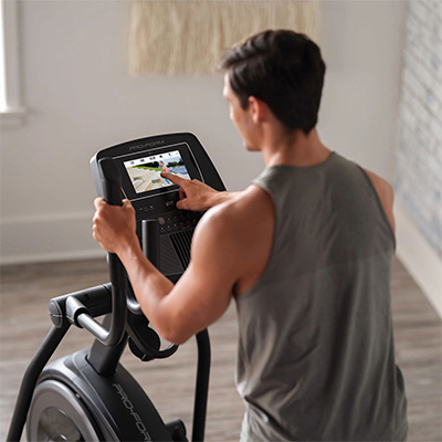 Person using console of the ProForm Carbon E7 Elliptical