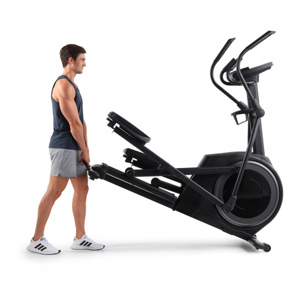 Person moving the ProForm Carbon E7 Elliptical with wheels