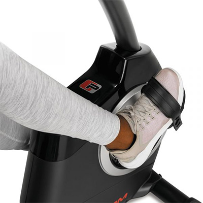 Close-up of a user’s foot secured in the pedal strap on the ProForm 325 CSX Recumbent Bike 