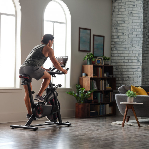 Model cycling on the ProForm Pro Trainer 500 Bike during an iFIT workout