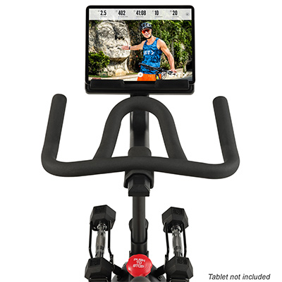 Handlebar and display close-up with tablet on the ProForm Pro Trainer 500 Bike.