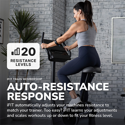 Model using the ProForm 225 CSX Upright Exercise Bike with auto-resistance response 