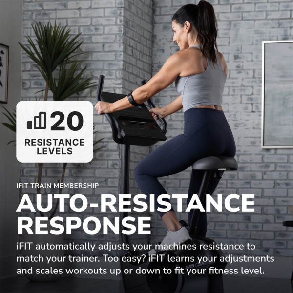 Model using the ProForm 225 CSX Upright Exercise Bike with auto-resistance response