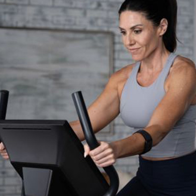 Closeup of a model riding the ProForm 225 CSX Upright Exercise Bike 