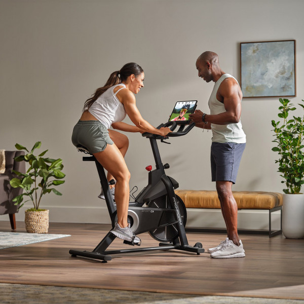 Model guiding workout on the ProForm Sport CX Bike with iFIT