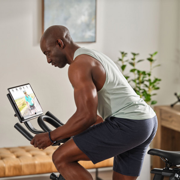 Model cycling on the ProForm Sport CX Bike at home