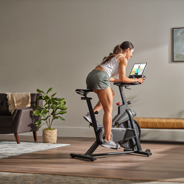 Model cycling on the ProForm Sport CX Bike during an iFIT workout