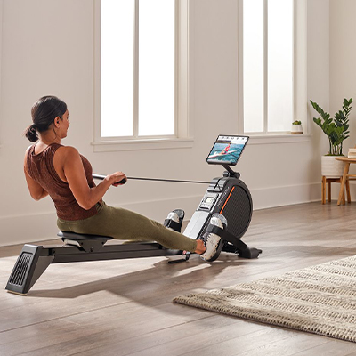 Image of a model using the ProForm 550R Rower at home