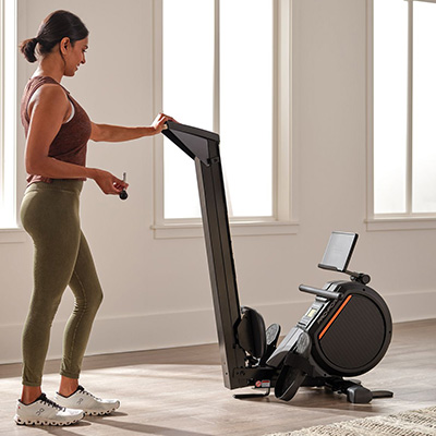 Image of a model folding the ProForm 550R Rower