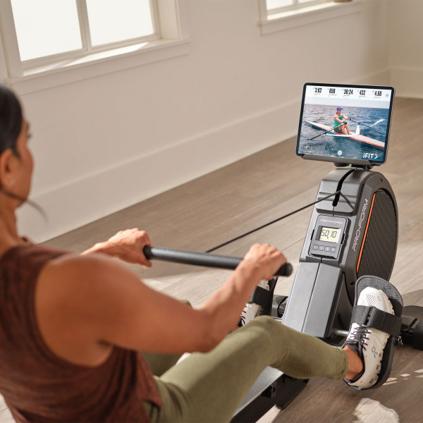 Lifestyle image of the ProForm 550R Rower in a home setting. The photo shows the tablet holder with a tablet in it. Please note that the tablet is not included in the purchase.