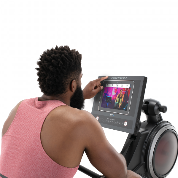 A user operating a Proform Pro R10 Rower LCD