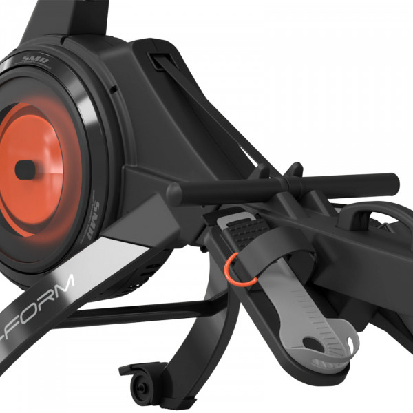 Close-up detail of the ProForm Carbon Pro10 Rower flywheel housing, handlebar, and adjustable foot pedals