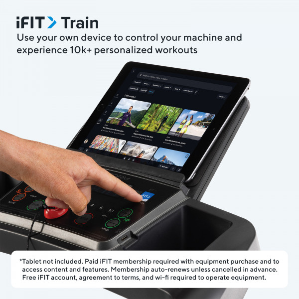 Model using tablet with iFIT on the ProForm Sport Treadmill console
