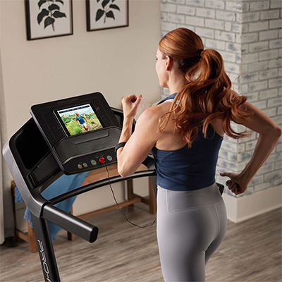 Model using iFIT workout content on the ProForm Carbon TL Treadmill 