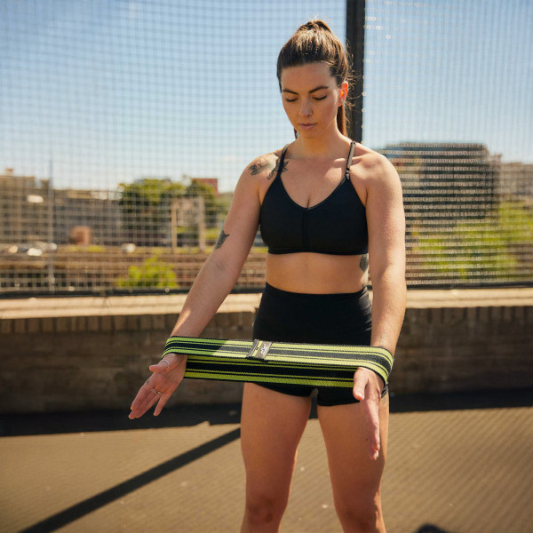 User using the yellow PTP MicroBand X around forearms