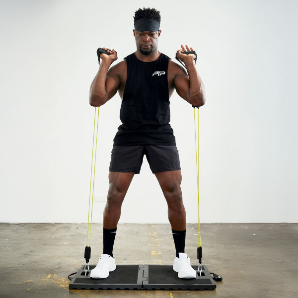 User doing bicep curls indoors