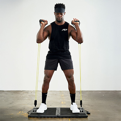 User doing bicep curls indoors