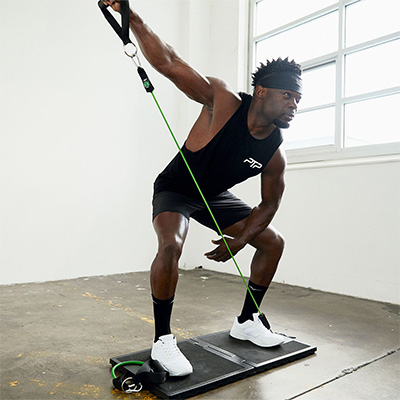 User doing single-arm press indoors