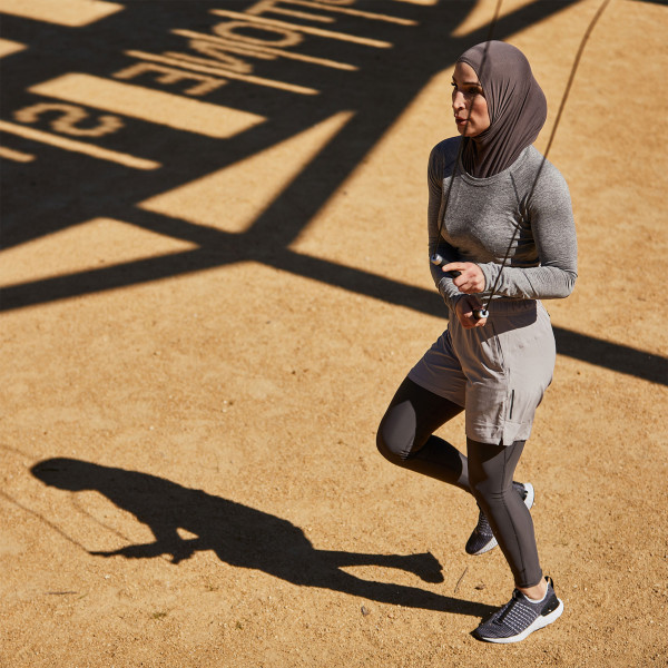 User skipping outdoors with the PTP Elite Jump Rope