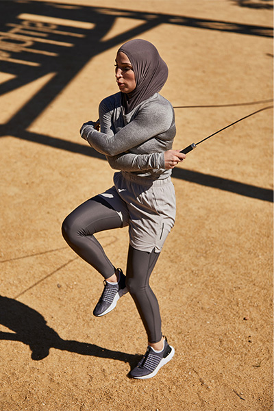 User skipping outdoors with the PTP Elite Jump Rope