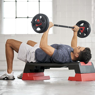 Bench press on the red Reebok Step