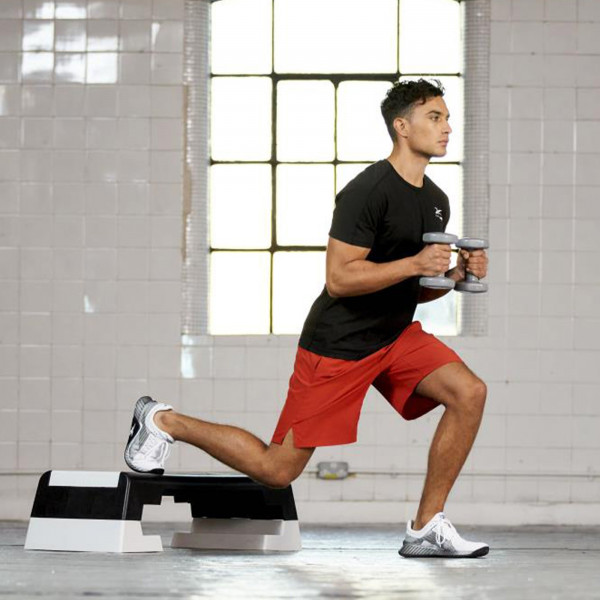 Rear foot elevated lunge on the white Reebok Step