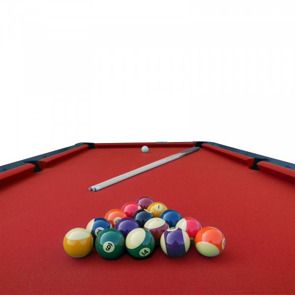 Close-up view of the Roberto Sport First 8ft Pool Table with red cloth, showing numbered balls, a white ball, and a cue on the playing surface.
