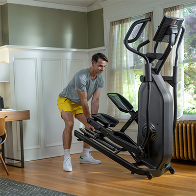 Model moving the Schwinn 590E Elliptical using transport wheels