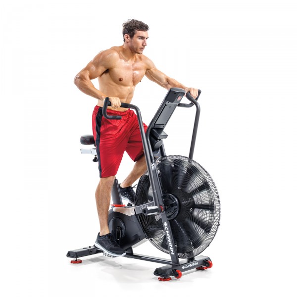A person exercising on the Schwinn Airdyne AD8 Airbike, highlighting the bike's ergonomic design and comfort during use