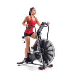 An individual engaging in an intense workout session on the Schwinn Airdyne AD8 Airbike, demonstrating the bike's versatility and high performance