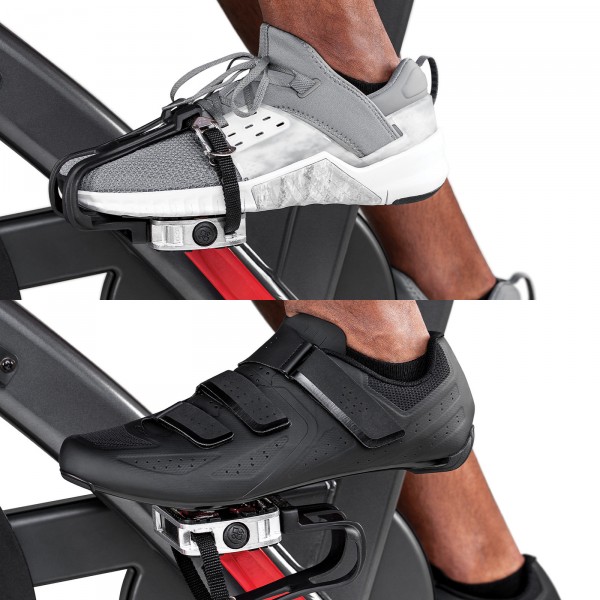 Dual-sided pedals on the Schwinn 800IC Indoor Cycling Bike showcasing both standard toe cages and SPD clips for a flexible cycling experience