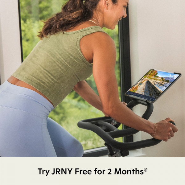 Model using the JRNY app on the Schwinn IC3.5 Indoor Cycle