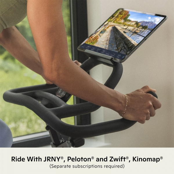 Tablet displaying JRNY, Peloton and Zwift compatibility on the Schwinn IC3.5 Indoor Cycle
