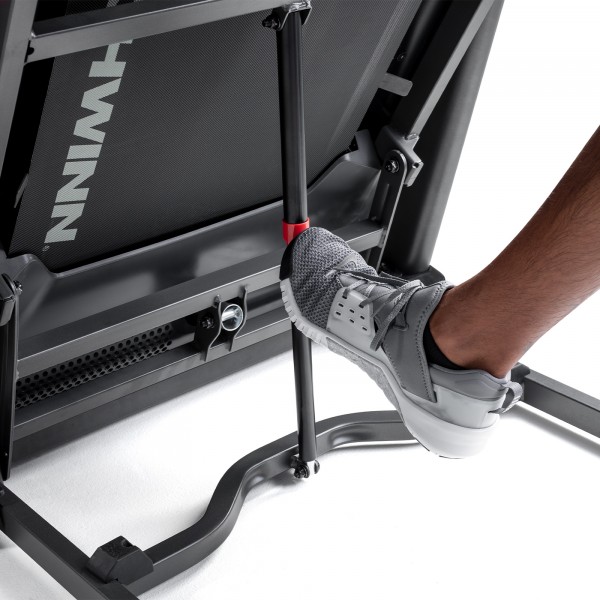 Close view of the Schwinn 510T Treadmill's SoftDrop™ folding mechanism.