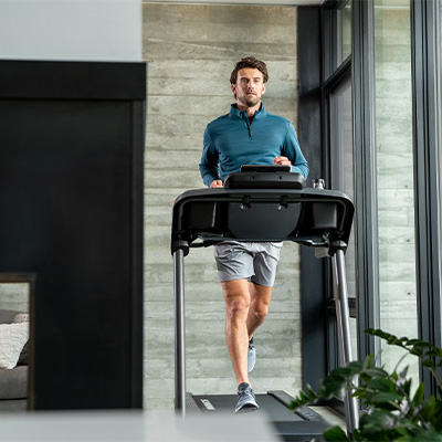 Front view of user running on the Schwinn 510T treadmill
