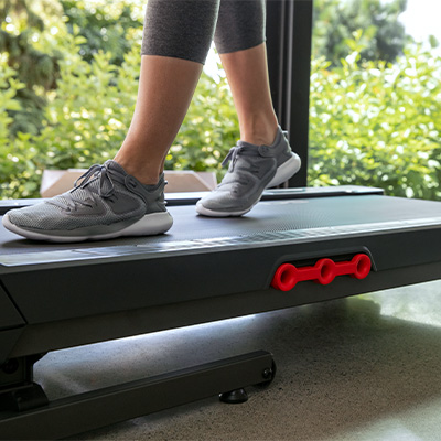 Close-up of user walking on the Schwinn 510T treadmill deck