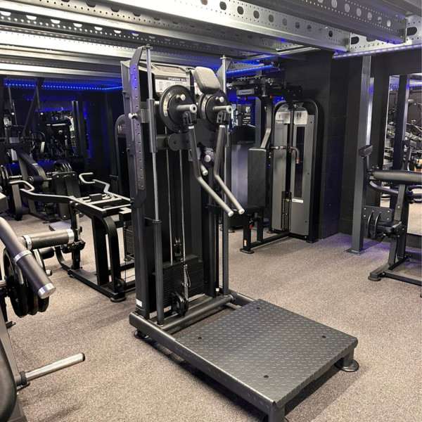 Carousel image of the Skelcore Elite Standing Multi Flight Machine in a gym environment