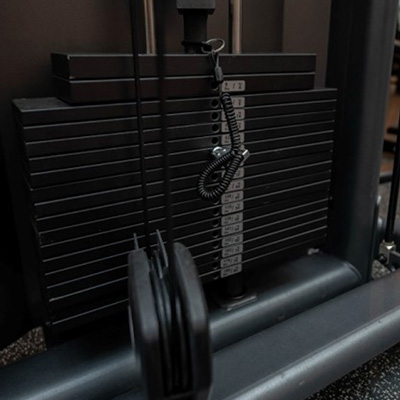 A photograph of the Skelcore Elite Standing Multi Flight Machine weight stack.