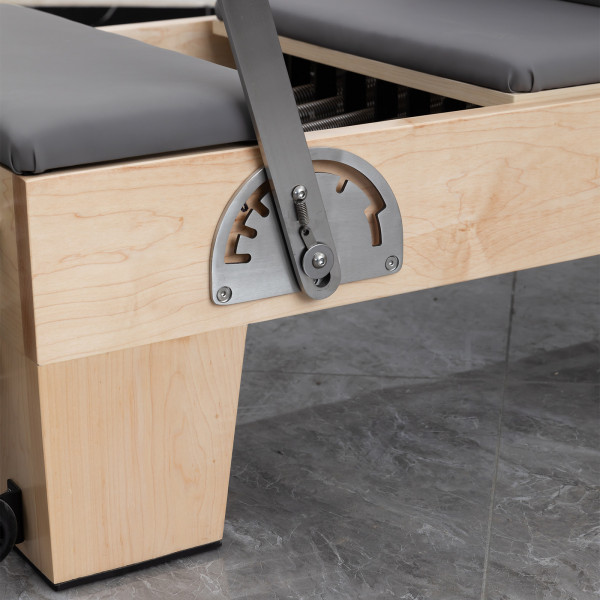 Side view of footbar and frame detailing on the Skelcore Classic Reformer - American Maple