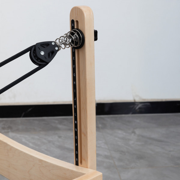 Close-up of pulley height adjustment on the Skelcore Classic Reformer - American Maple